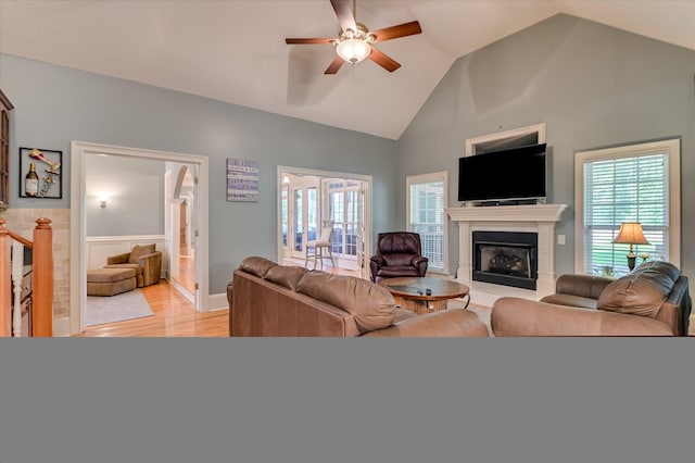 3953 Bolton St, Augusta, GA 30909 - living area with light wood finished floors, ceiling fan, a fireplace, wainscoting, and healthy amount of natural light