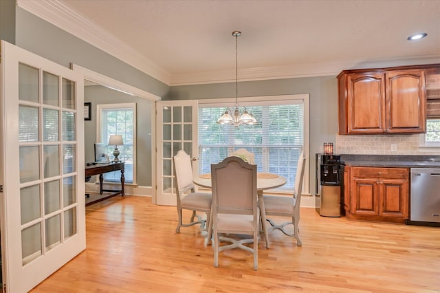 3953 Bolton St, Augusta, GA 30909 - dining space featuring crown molding, a chandelier, plenty of natural light, light wood-style flooring, and a desk
