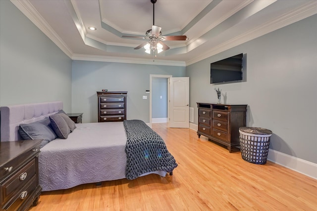 3953 Bolton St, Augusta, GA 30909 - bedroom featuring light wood finished floors, ornamental molding, a raised ceiling, and a ceiling fan