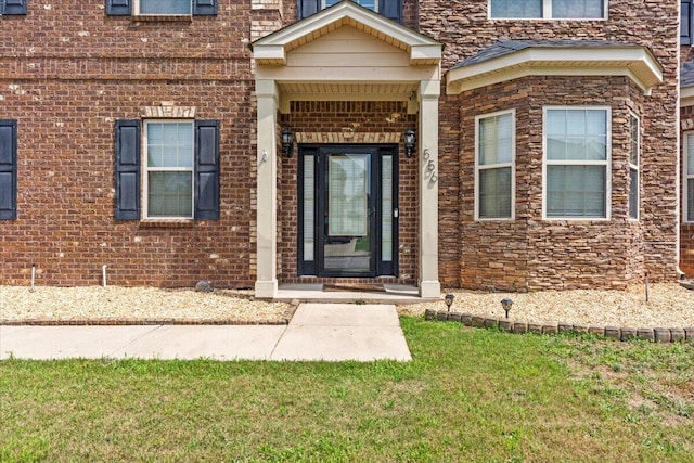 556 Ernestine Fls, Grovetown, GA 30813 - doorway to property featuring brick siding and a lawn