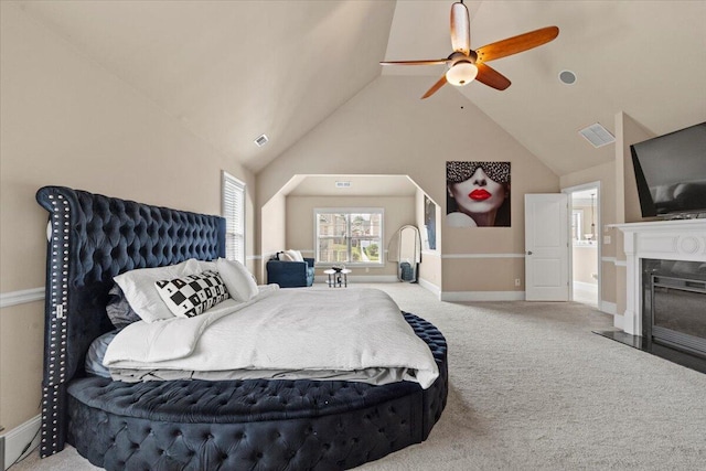 556 Ernestine Fls, Grovetown, GA 30813 - carpeted bedroom with vaulted ceiling, a fireplace with flush hearth, and a ceiling fan
