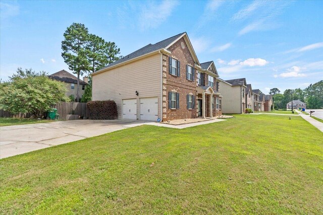 556 Ernestine Fls, Grovetown, GA 30813 - view of side of home with brick siding, a garage, concrete driveway, and a residential view