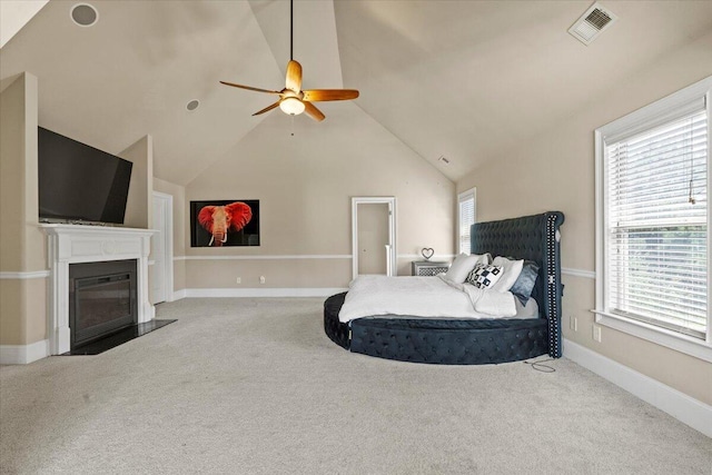 556 Ernestine Fls, Grovetown, GA 30813 - carpeted bedroom featuring multiple windows, lofted ceiling, a fireplace with flush hearth, and ceiling fan