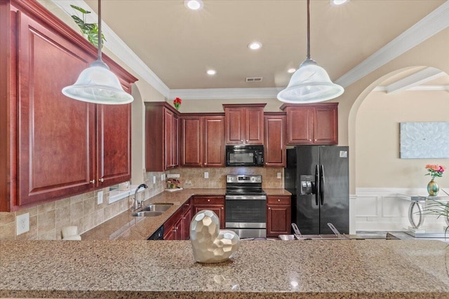 556 Ernestine Fls, Grovetown, GA 30813 - kitchen with black appliances, arched walkways, crown molding, pendant lighting, and a peninsula