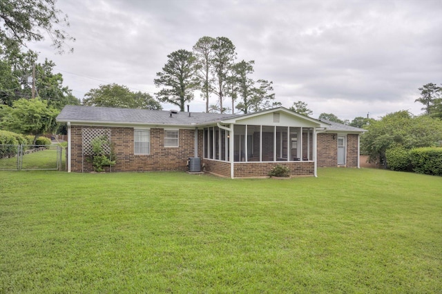 3593 Westhampton Dr, Martinez, GA 30907 - back of property featuring a sunroom, brick siding, and central AC