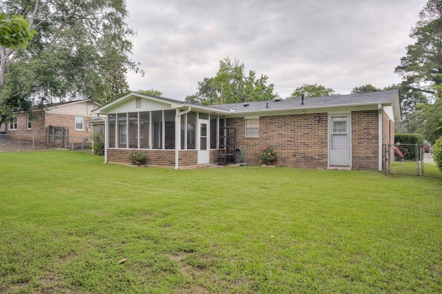 3593 Westhampton Dr, Martinez, GA 30907 - back of property featuring brick siding, a sunroom, and a gate