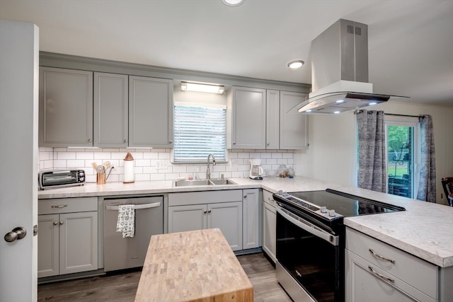 3593 Westhampton Dr, Martinez, GA 30907 - kitchen with appliances with stainless steel finishes, island exhaust hood, a sink, gray cabinets, and recessed lighting