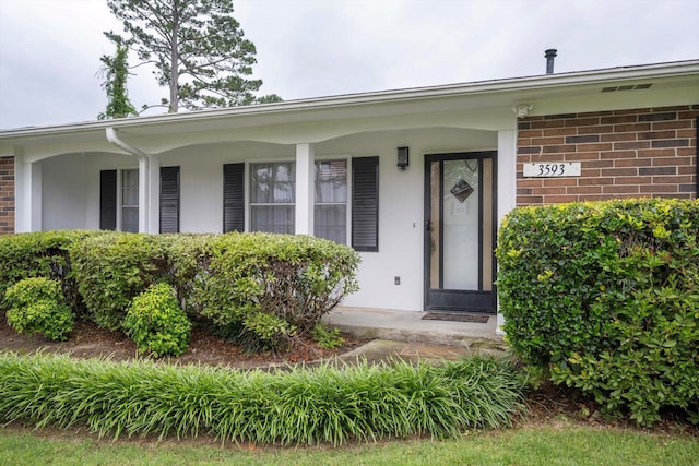 3593 Westhampton Dr, Martinez, GA 30907 - view of exterior entry with brick siding and covered porch