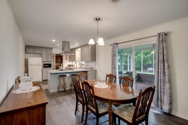 3593 Westhampton Dr, Martinez, GA 30907 - dining area featuring dark wood-type flooring, ornamental molding, and baseboards