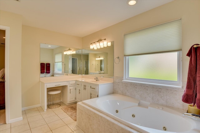 full bath with tile patterned floors, a tub with jets, and vanity