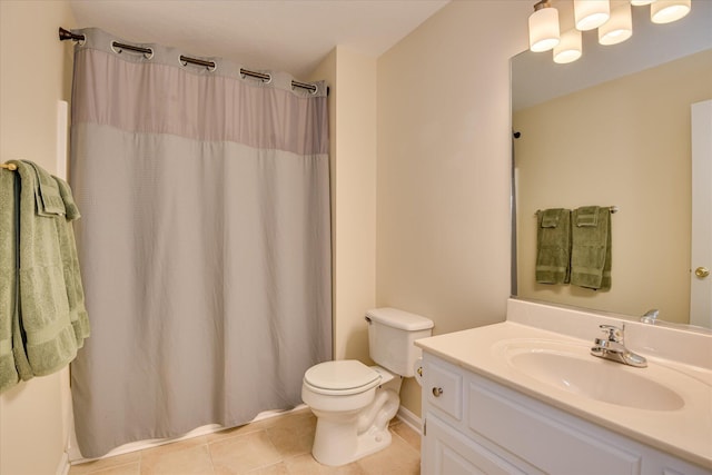 bathroom featuring toilet, tile patterned floors, a shower with curtain, and vanity