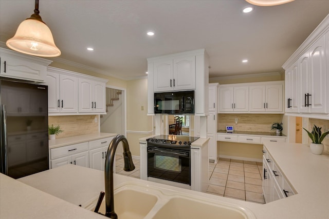 kitchen featuring light tile patterned floors, white cabinets, backsplash, and black appliances