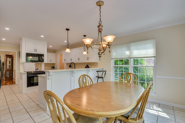 dining space with crown molding, an inviting chandelier, baseboards, recessed lighting, and light tile patterned floors