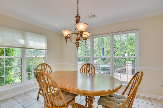 dining area featuring light tile patterned flooring, visible vents, a healthy amount of sunlight, and an inviting chandelier