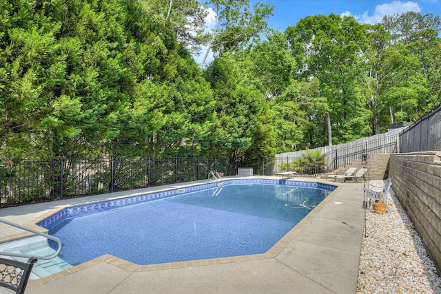 view of pool with a fenced in pool, a fenced backyard, and a patio area