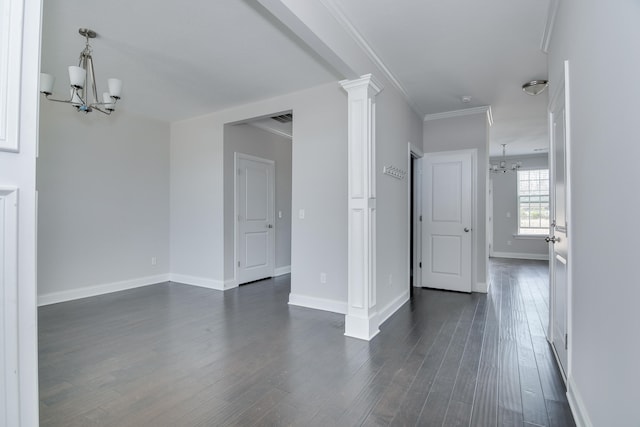 141 Caroleton Dr, Grovetown, GA 30813 - empty room with a chandelier, dark wood finished floors, ornate columns, and crown molding