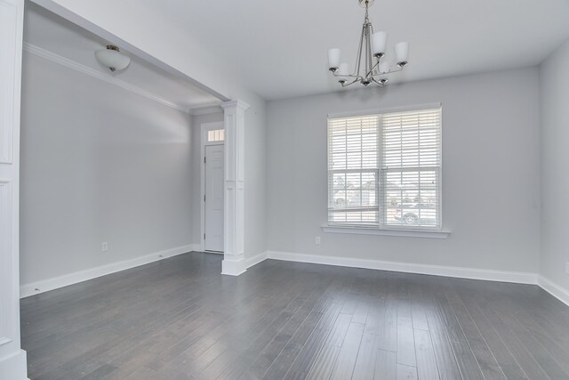 141 Caroleton Dr, Grovetown, GA 30813 - spare room with a chandelier, dark wood-type flooring, crown molding, and ornate columns