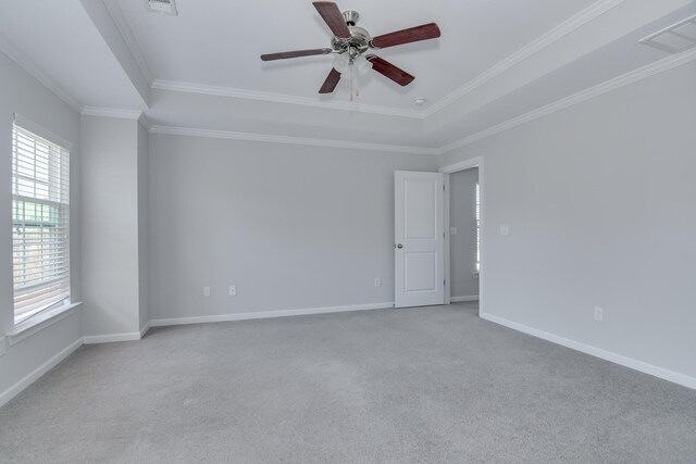 141 Caroleton Dr, Grovetown, GA 30813 - unfurnished room with plenty of natural light, a ceiling fan, ornamental molding, light carpet, and a tray ceiling