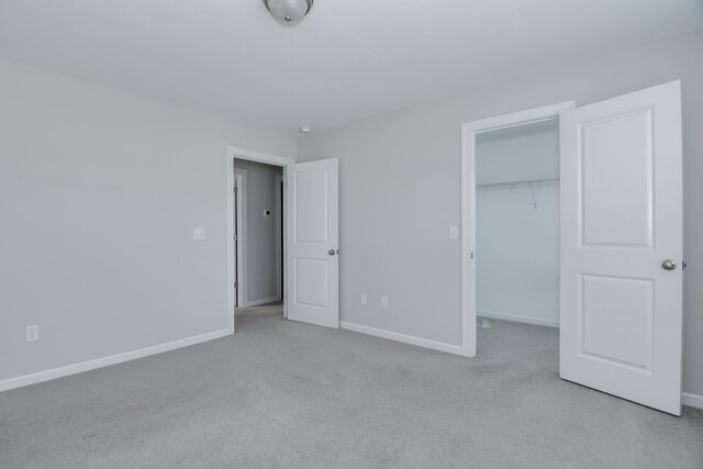 141 Caroleton Dr, Grovetown, GA 30813 - unfurnished bedroom featuring carpet floors, a spacious closet, and a closet