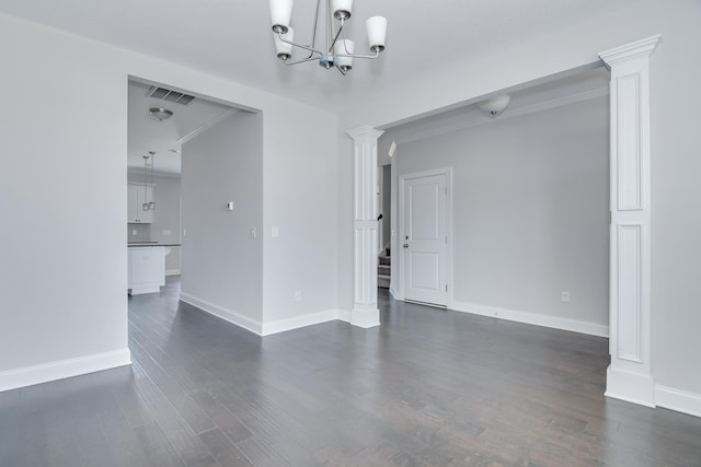 141 Caroleton Dr, Grovetown, GA 30813 - spare room featuring a chandelier, ornate columns, dark wood-style flooring, stairs, and crown molding