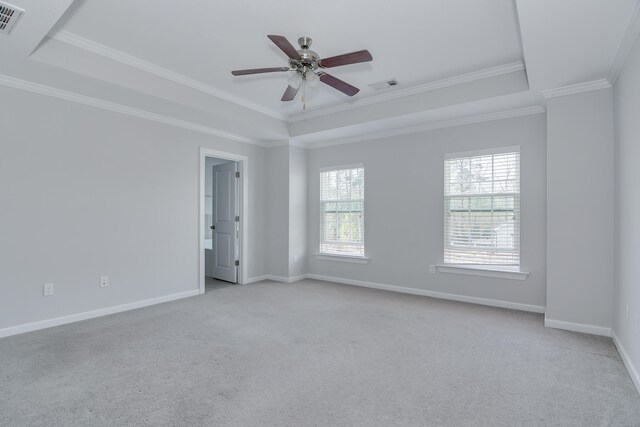 141 Caroleton Dr, Grovetown, GA 30813 - spare room featuring light carpet, crown molding, a tray ceiling, and a ceiling fan