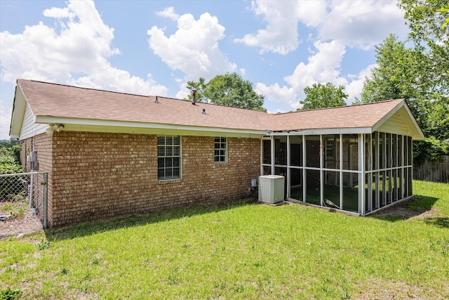 2701 Gardenbrook Ct, Augusta, GA 30906 - back of property featuring brick siding, a sunroom, central AC unit, and a shingled roof