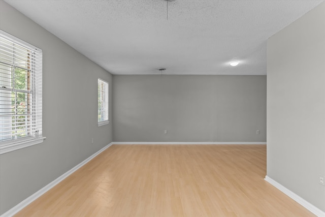 2701 Gardenbrook Ct, Augusta, GA 30906 - spare room with light wood-style floors, a textured ceiling, and baseboards