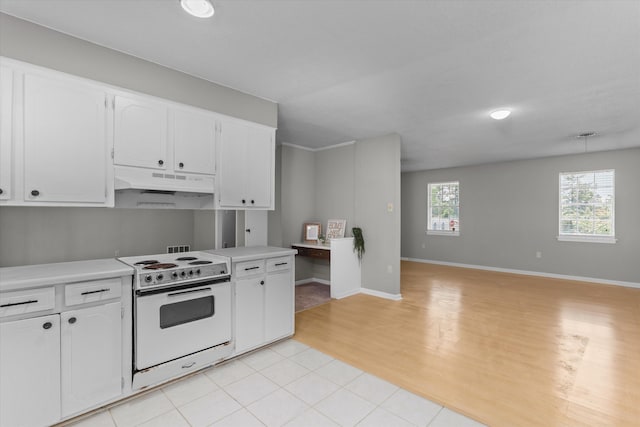 2701 Gardenbrook Ct, Augusta, GA 30906 - kitchen featuring white range with electric stovetop, under cabinet range hood, white cabinetry, light countertops, and light wood finished floors