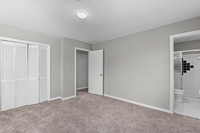 2701 Gardenbrook Ct, Augusta, GA 30906 - unfurnished bedroom featuring carpet flooring, baseboards, a closet, ensuite bathroom, and a textured ceiling