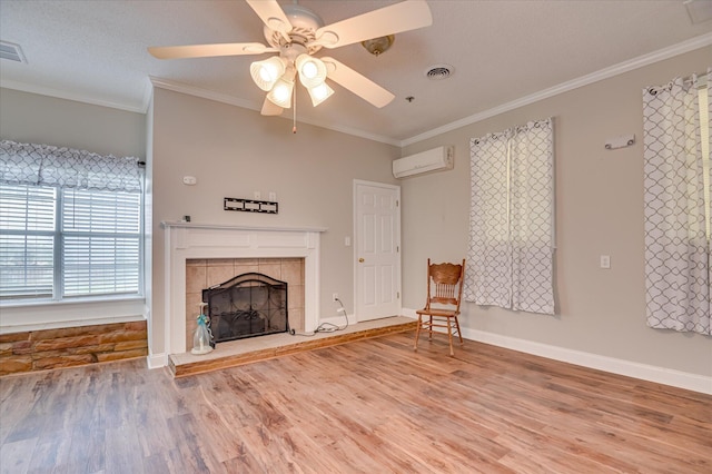 280 W Forrest St, Harlem, GA 30814 - unfurnished living room with wood finished floors, a wall mounted AC, crown molding, ceiling fan, and a fireplace