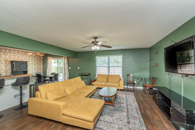 living area featuring plenty of natural light, a ceiling fan, and wood finished floors
