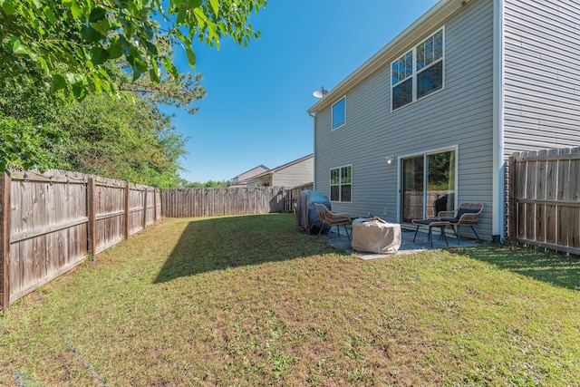 exterior space featuring a fenced backyard and a patio area