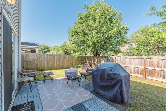 view of patio / terrace featuring area for grilling and a fenced backyard