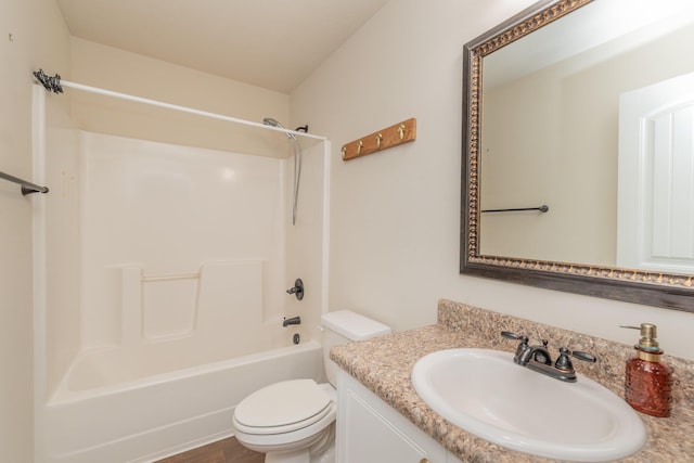 full bath with vanity, toilet, and  shower combination