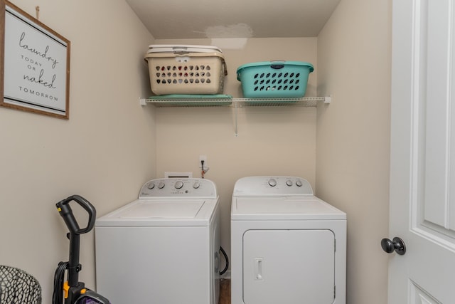 washroom with laundry area and washer and clothes dryer