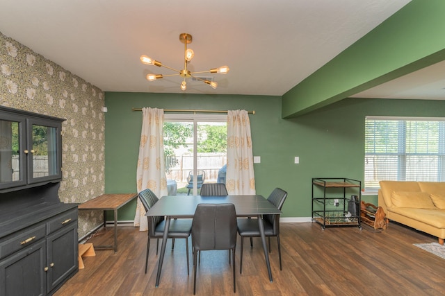 dining room with baseboards, dark wood-type flooring, and a chandelier