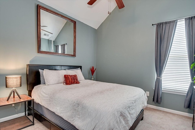 bedroom featuring visible vents, light carpet, baseboards, ceiling fan, and vaulted ceiling