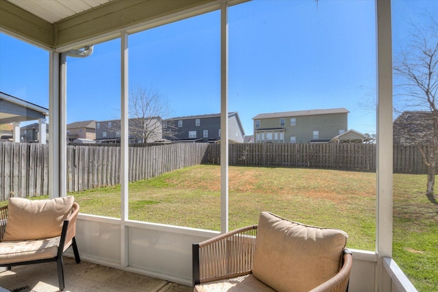 sunroom featuring a residential view