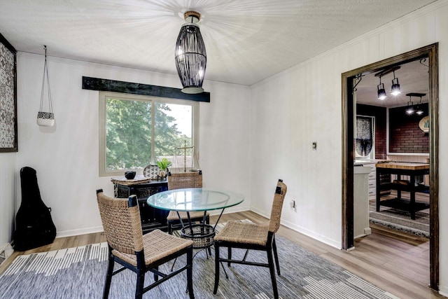 707 Oriole St, Aiken, SC 29803 - dining room featuring wood finished floors, ornamental molding, and baseboards
