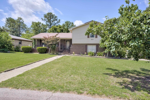 707 Oriole St, Aiken, SC 29803 - split level home featuring brick siding, a front yard, and metal roof
