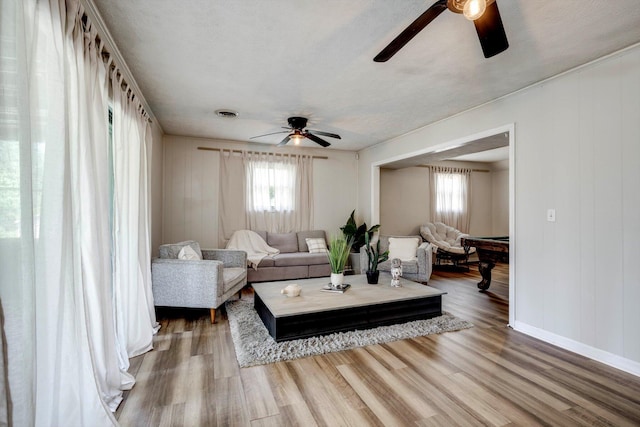 707 Oriole St, Aiken, SC 29803 - living area featuring a ceiling fan, wood finished floors, and baseboards