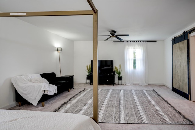 707 Oriole St, Aiken, SC 29803 - carpeted bedroom featuring a barn door, baseboards, and ceiling fan