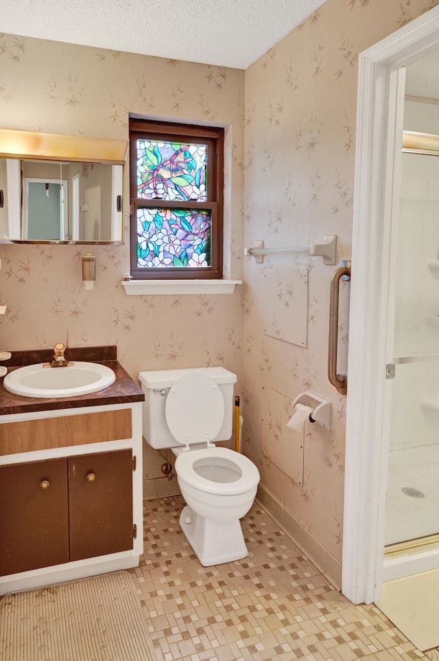 3613 Concord Ct, Augusta, GA 30906 - full bathroom with a stall shower, vanity, wallpapered walls, and a textured ceiling