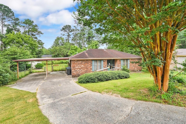 3613 Concord Ct, Augusta, GA 30906 - ranch-style home with brick siding, driveway, a front lawn, and a carport