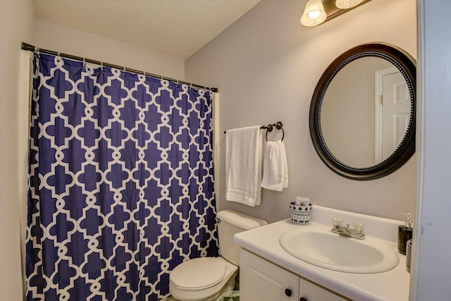 bathroom with toilet, vanity, a shower with curtain, and a textured ceiling