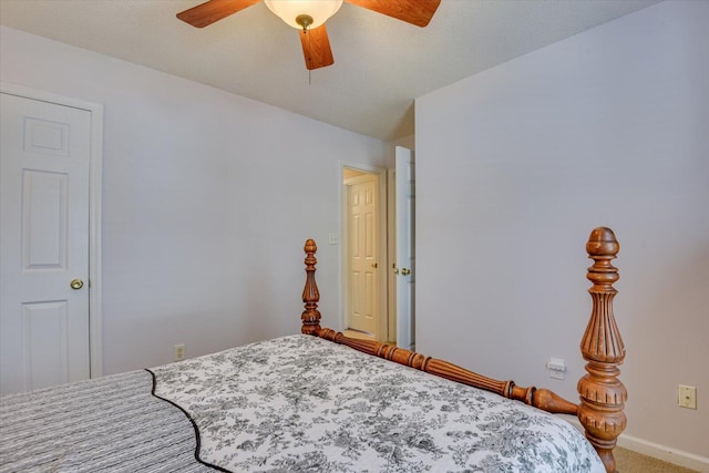 bedroom featuring baseboards, a ceiling fan, and carpet flooring
