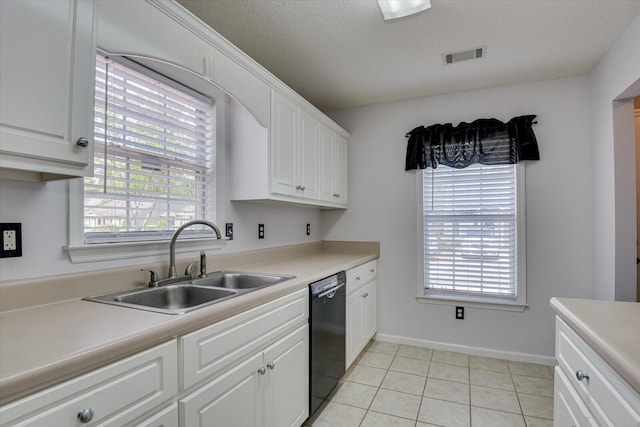 kitchen with visible vents, a sink, black dishwasher, and a healthy amount of sunlight