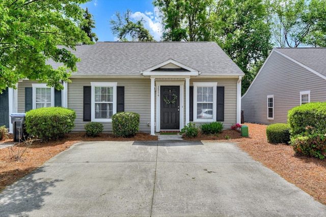 bungalow with a shingled roof