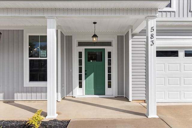 entrance to property featuring board and batten siding and covered porch