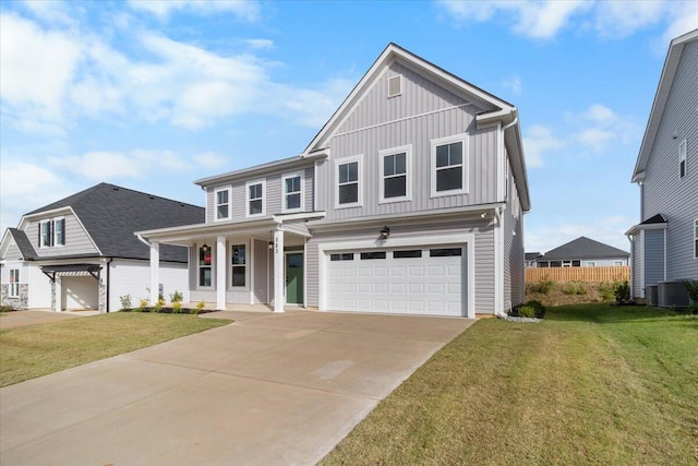 view of front of property featuring an attached garage, central AC, driveway, a front lawn, and board and batten siding